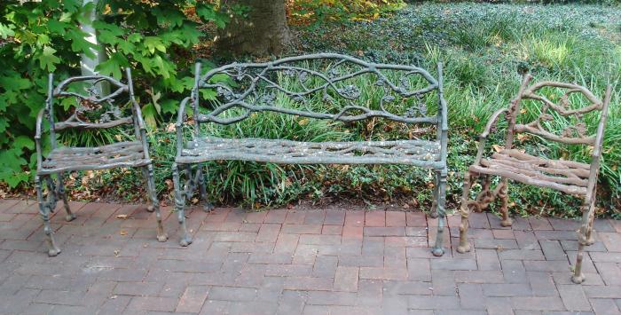 RUSTIC BENCH AND TWO CHAIRS, CAST IRON SET