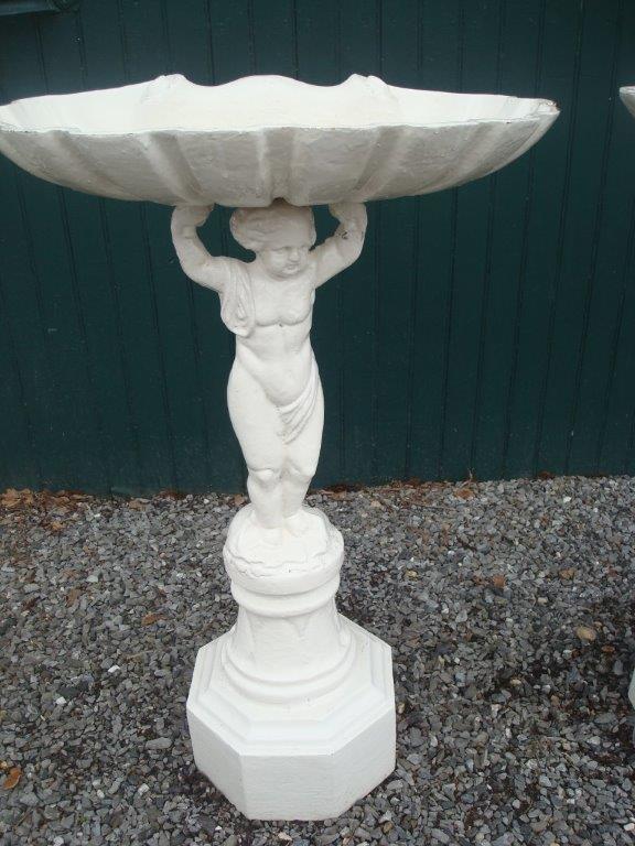BIRD BATHS, PAIR, CAST IRON PUTTO WITH SHELL BOWL